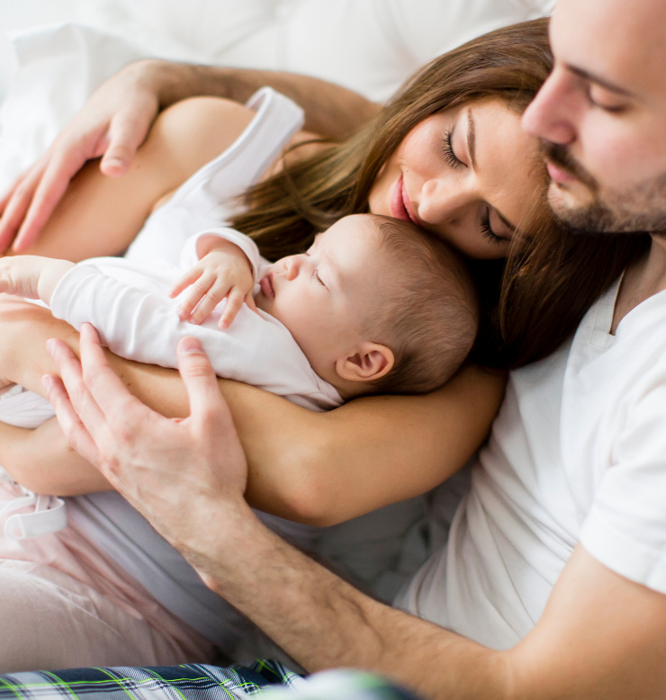 Father and mother holding their baby